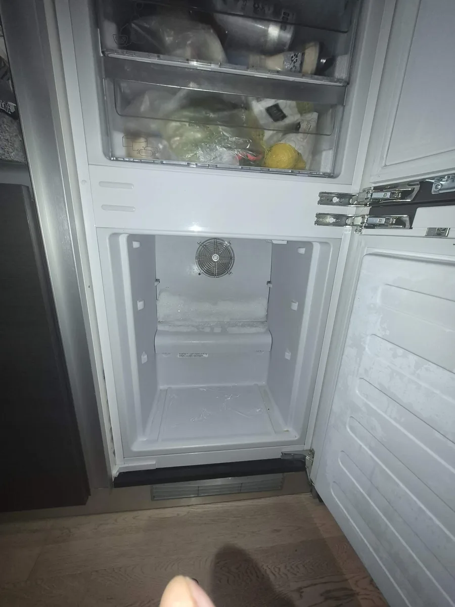 Ice buildup inside a Blomberg freezer caused by a clogged drain tube