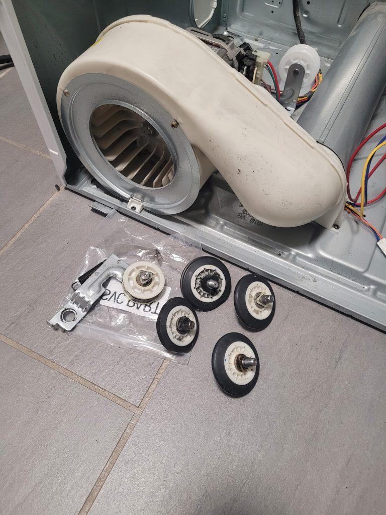 Dryer drum rollers and parts during a repair by Octopus Royal