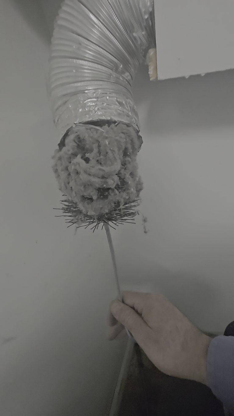 Dryer vent duct clogged with lint, found during a dryer repair by Octopus Royal