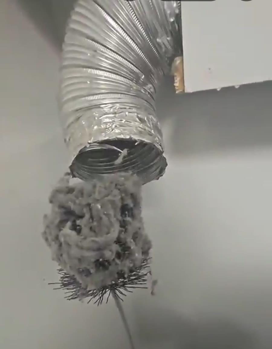 Lint pulled out of a clogged dryer vent duct in Toronto
