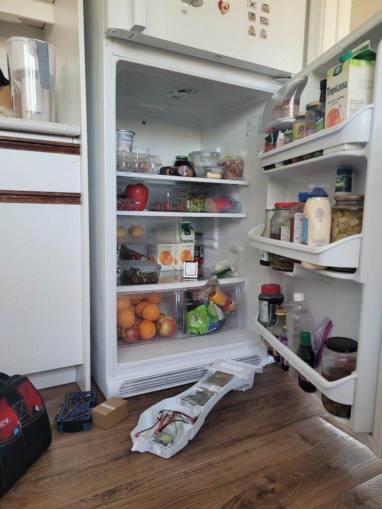 Refrigerator with the doors open during service by Octopus Royal