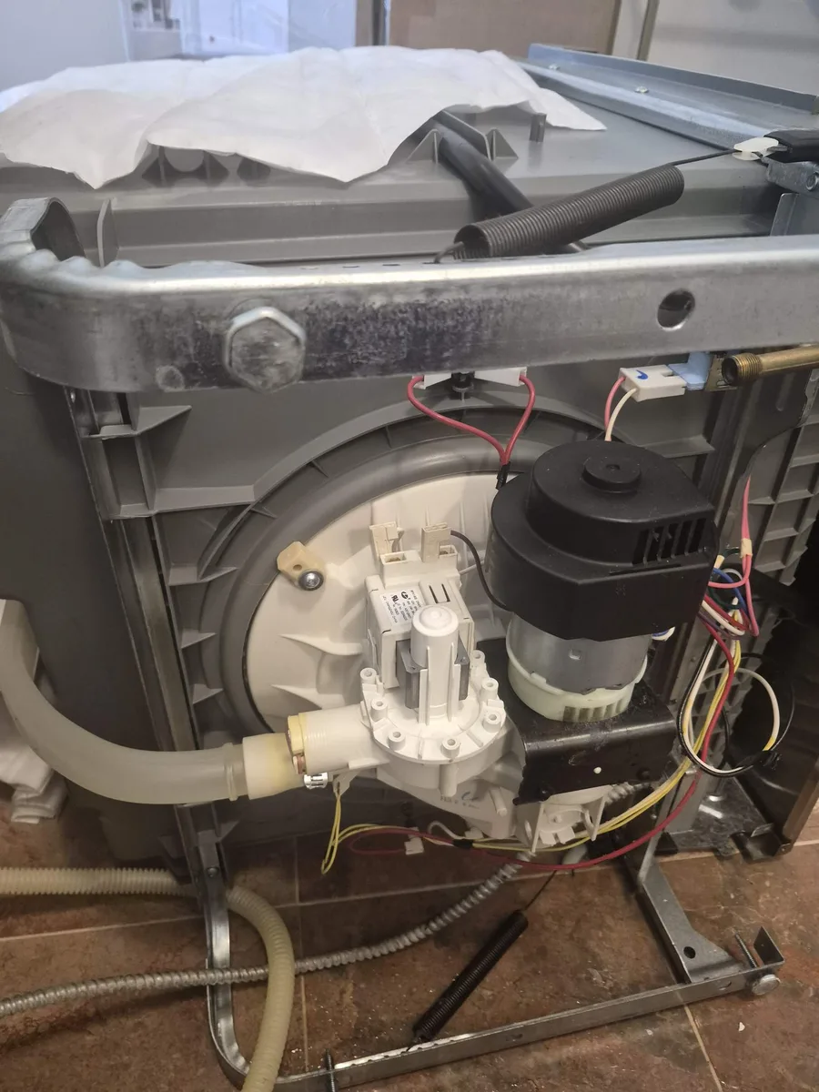 New drain pump installed on a Frigidaire dishwasher