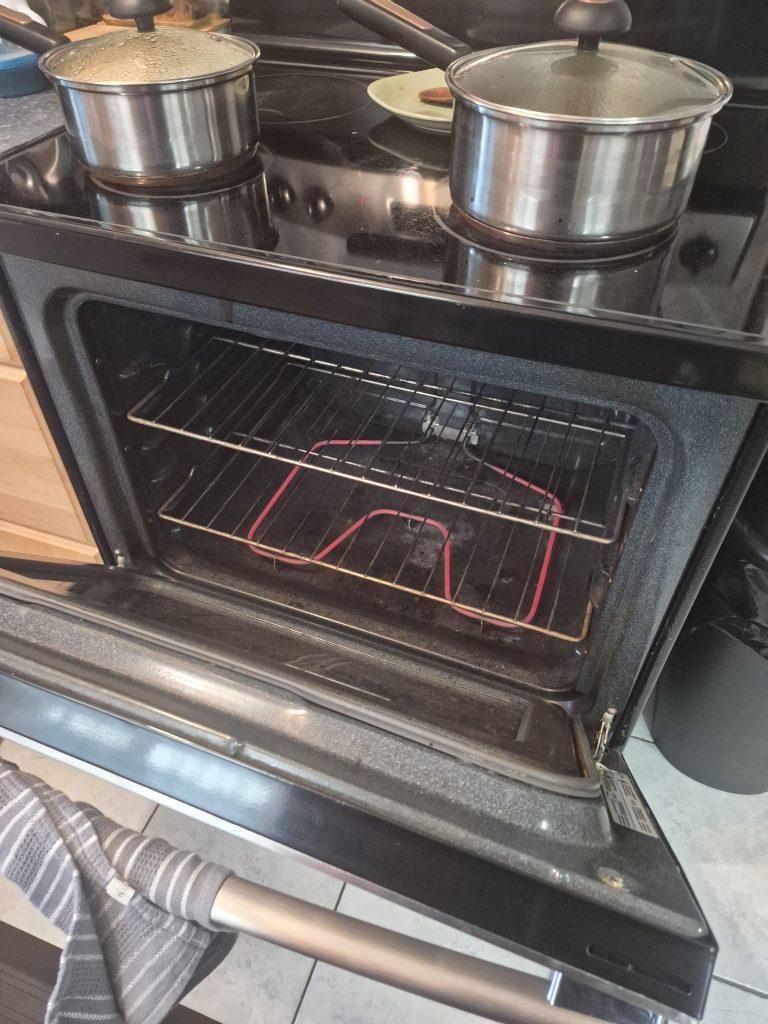 New bake element glowing red in a Kenmore oven after replacement, Toronto