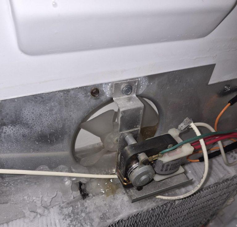 Iced-over evaporator and stuck evaporator fan inside an upright freezer, Vaughan
