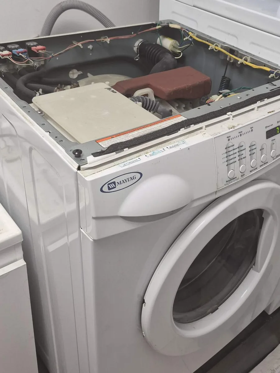 Maytag apartment-size washer being repaired in Downtown Toronto
