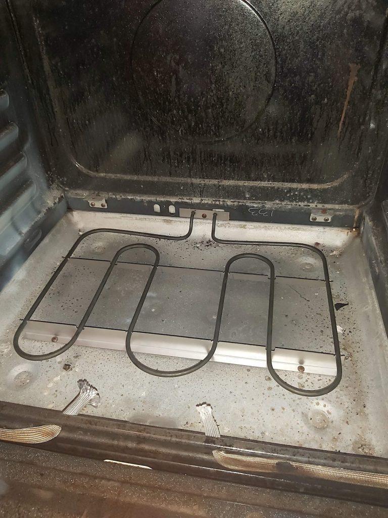 Oven bake element during an oven repair by Octopus Royal
