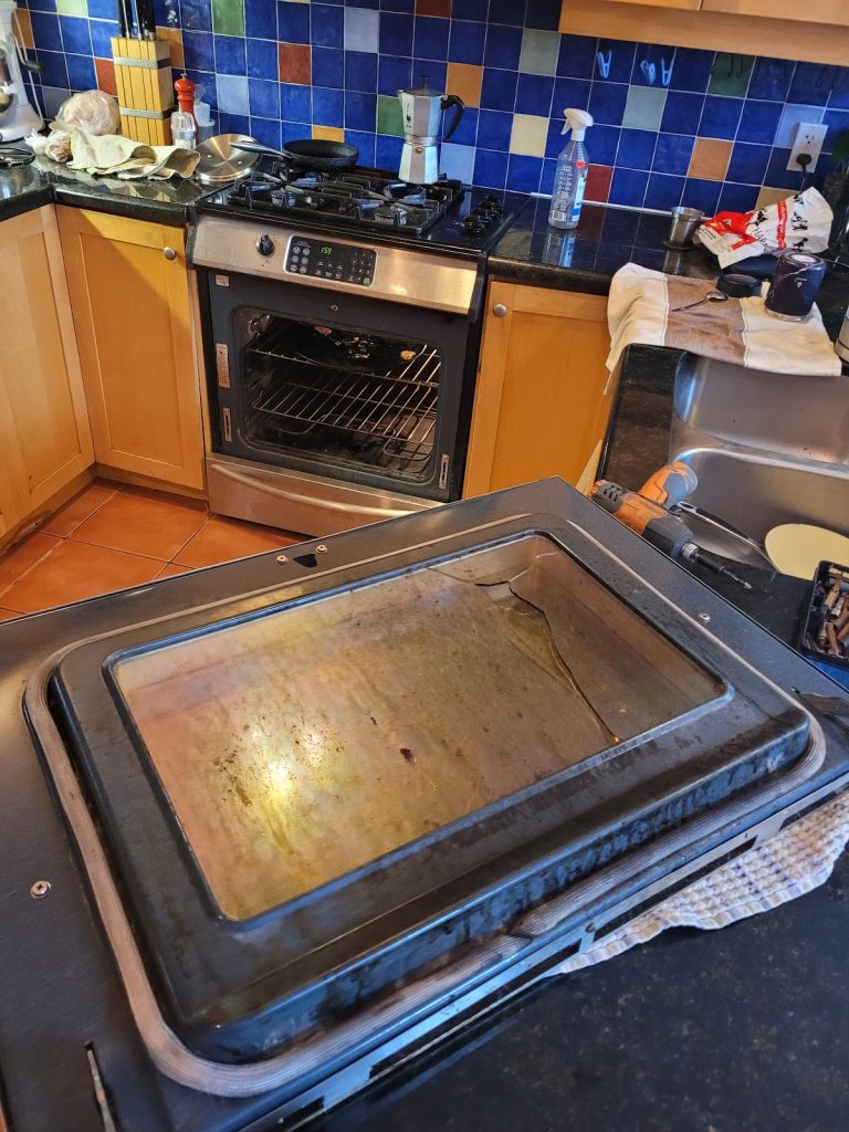 Oven door and interior during a repair by Octopus Royal
