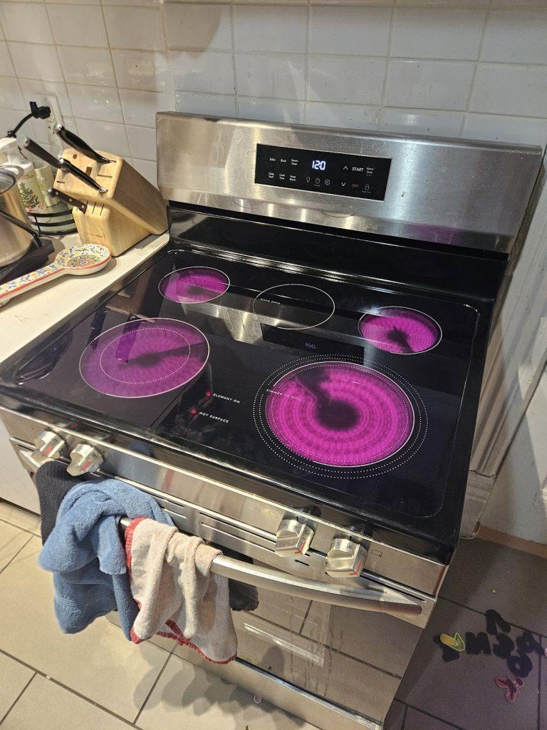 Electric cooktop elements glowing during testing by Octopus Royal