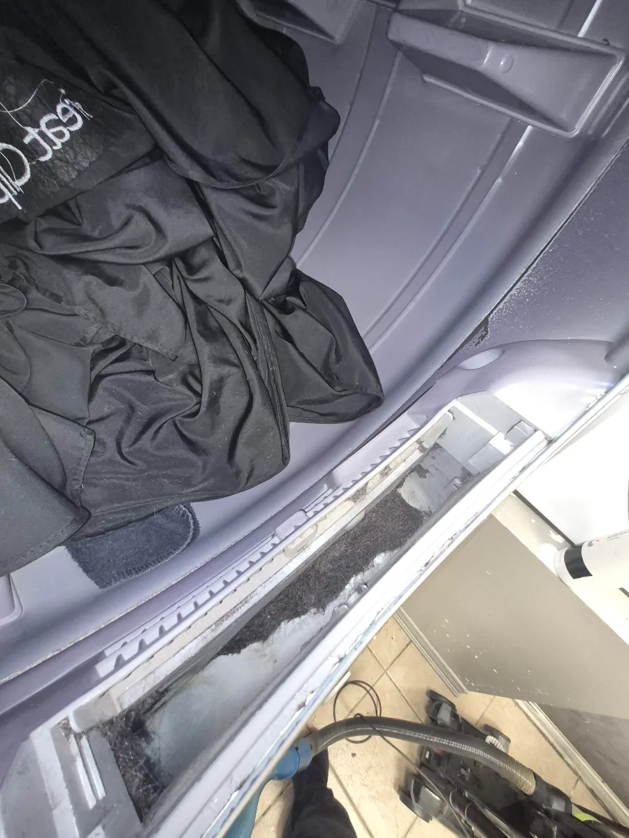 Samsung dryer lint filter housing packed with lint before cleaning