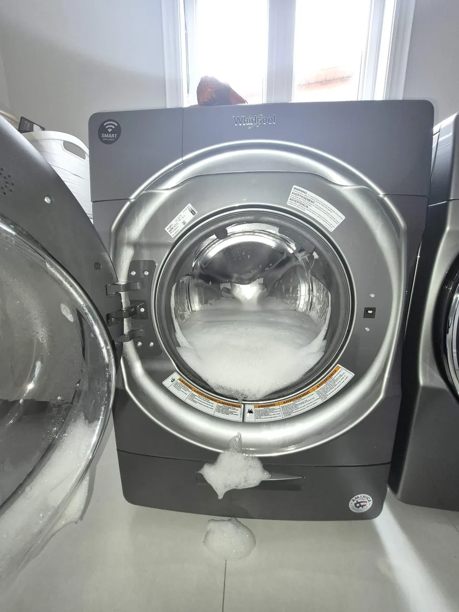 Whirlpool front-load washer with foam overflowing the drum after a SUD error